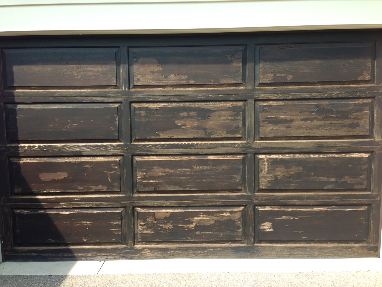 The Cost Of Refinishing A Wood Front Door Or Garage Door